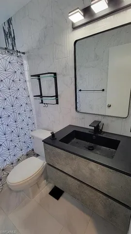 a bathroom with a bathtub and window