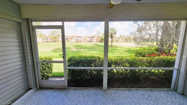 a view of room with window and a ceiling fan