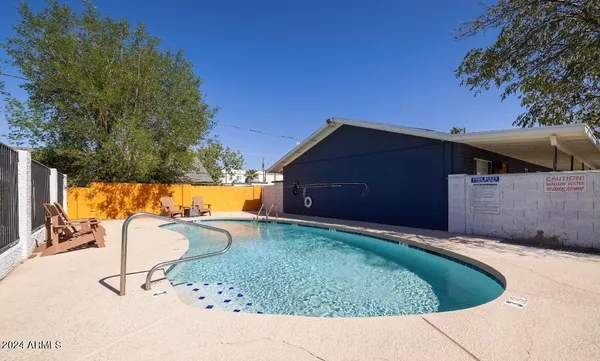 a backyard of a house with barbeque oven