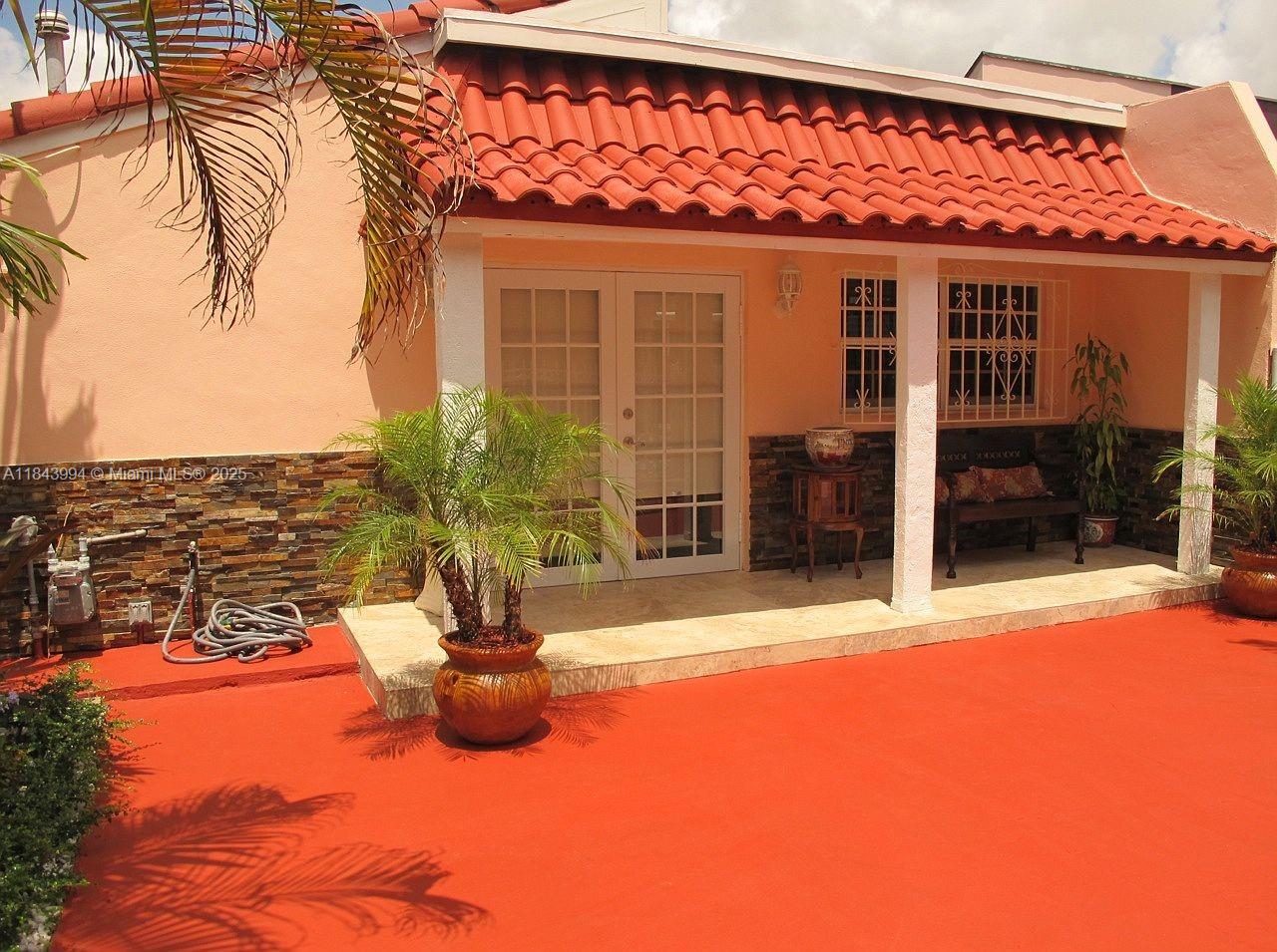 636 Northwest 11th Street, Unit 636 Miami, FL 33136 - Photo 8 of 17 a view of a patio with a table and chairs