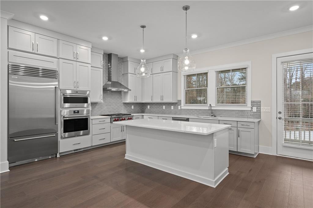 320 Anglin Walk Alpharetta, GA 30009 - Photo 13 of 67 a kitchen with a sink stainless steel appliances and cabinets