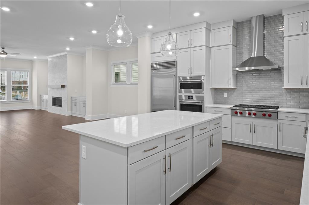320 Anglin Walk Alpharetta, GA 30009 - Photo 16 of 67 a kitchen with cabinets and white stainless steel appliances