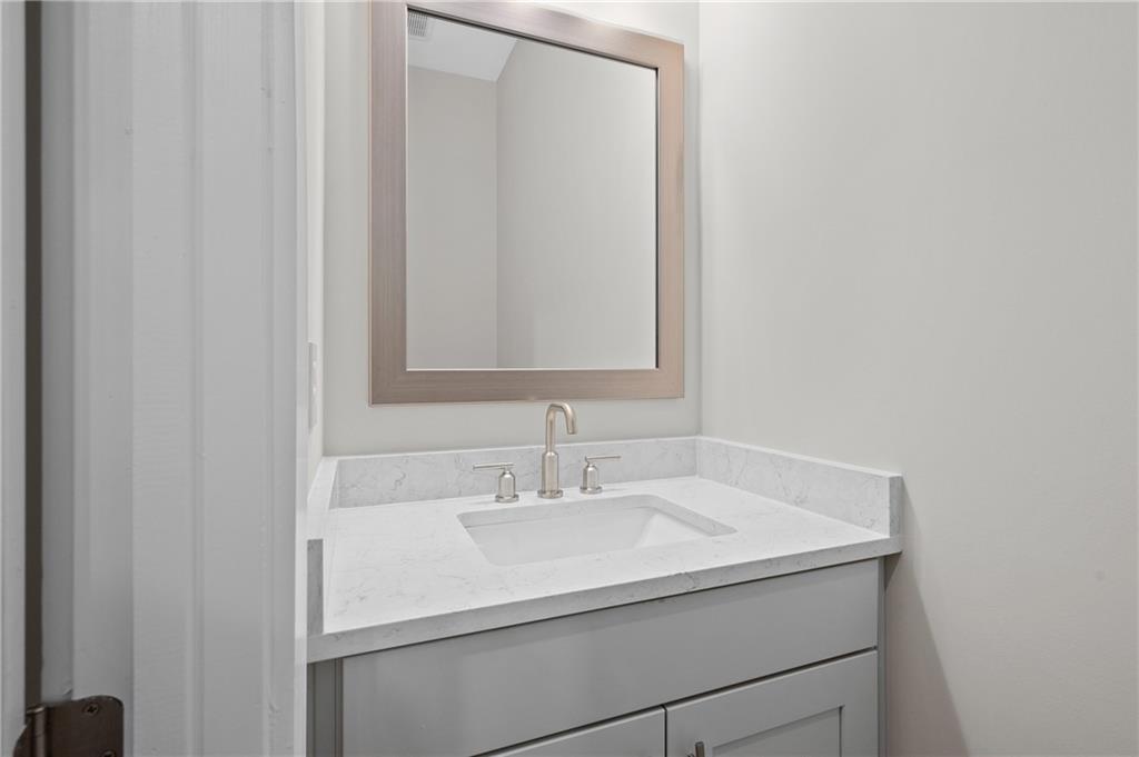 320 Anglin Walk Alpharetta, GA 30009 - Photo 18 of 67 a bathroom with a sink and a mirror