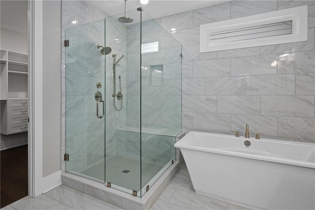 320 Anglin Walk Alpharetta, GA 30009 - Photo 24 of 67 a bathroom with a bathtub and shower