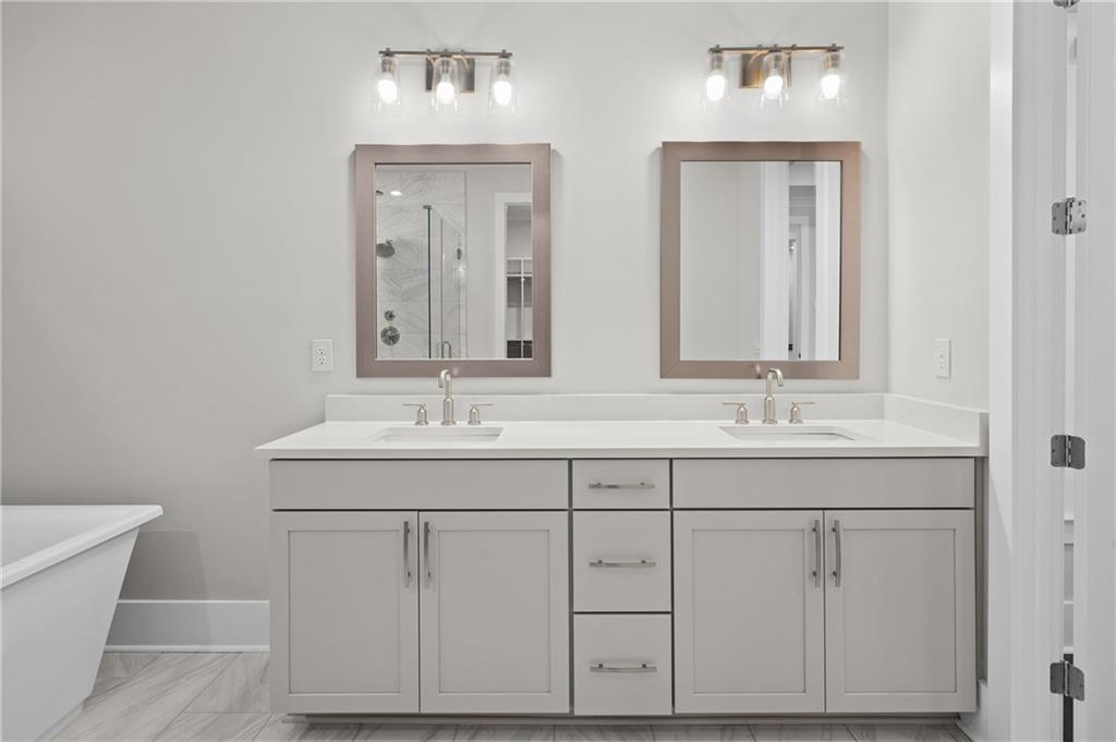 320 Anglin Walk Alpharetta, GA 30009 - Photo 25 of 67 a bathroom with a sink and a mirror