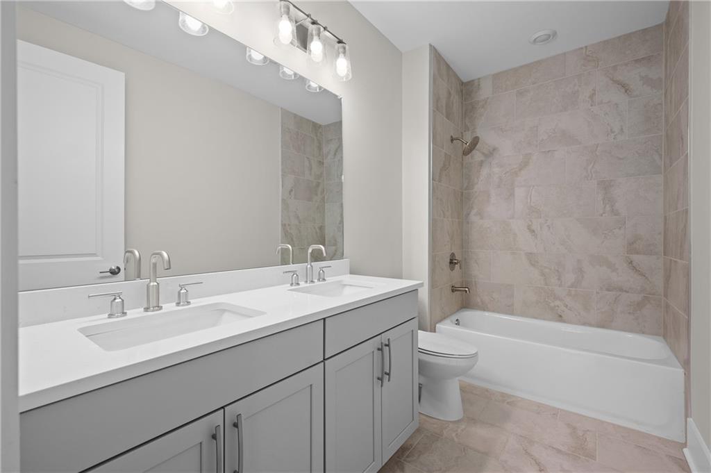 320 Anglin Walk Alpharetta, GA 30009 - Photo 28 of 67 a bathroom with a sink a toilet and shower