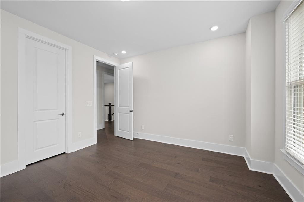 320 Anglin Walk Alpharetta, GA 30009 - Photo 30 of 67 a view of an empty room with wooden floor and a window