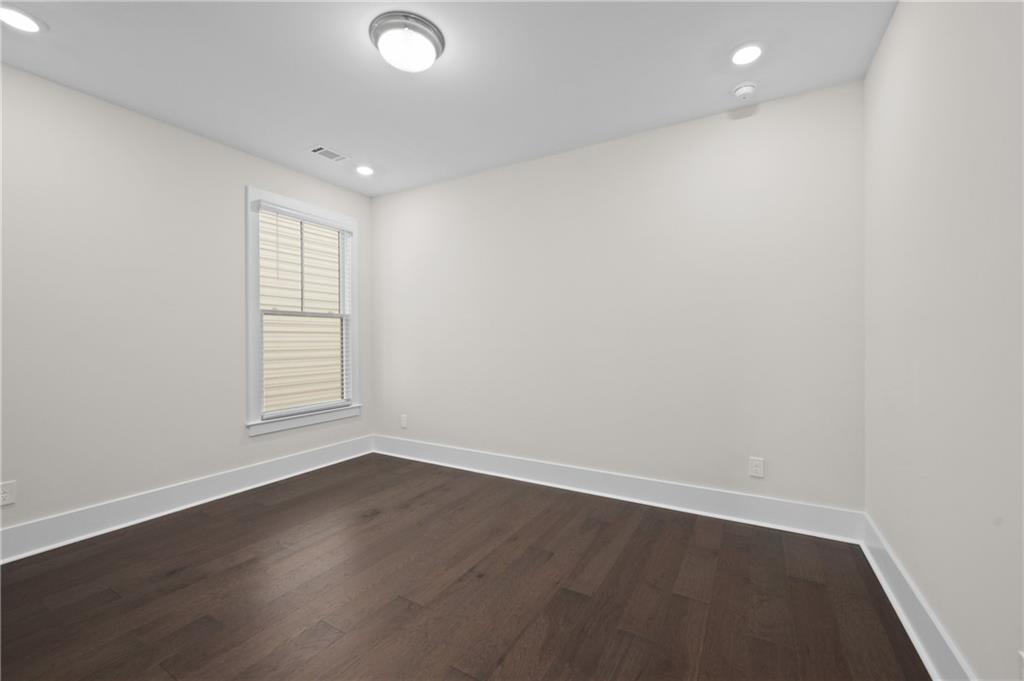 320 Anglin Walk Alpharetta, GA 30009 - Photo 31 of 67 an empty room with wooden floor and windows