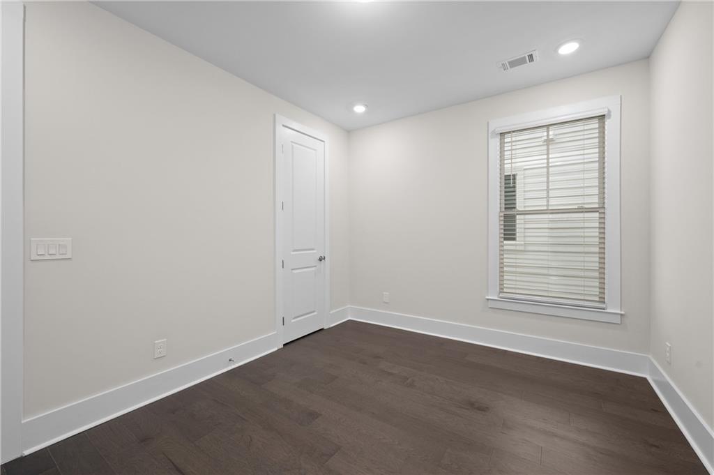 320 Anglin Walk Alpharetta, GA 30009 - Photo 32 of 67 an empty room with wooden floor and windows