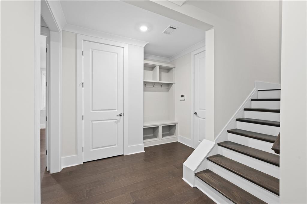 320 Anglin Walk Alpharetta, GA 30009 - Photo 33 of 67 a view of a livingroom with entryway and white walls