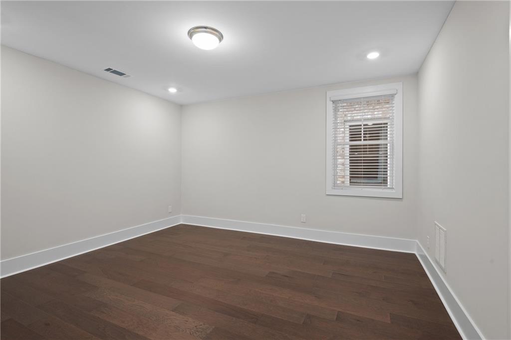 320 Anglin Walk Alpharetta, GA 30009 - Photo 34 of 67 an empty room with wooden floor and windows
