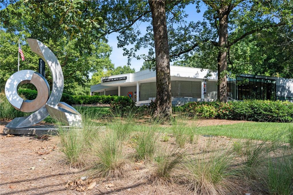 320 Anglin Walk Alpharetta, GA 30009 - Photo 52 of 67 a backyard of a house with barbeque oven fire pit table and chairs