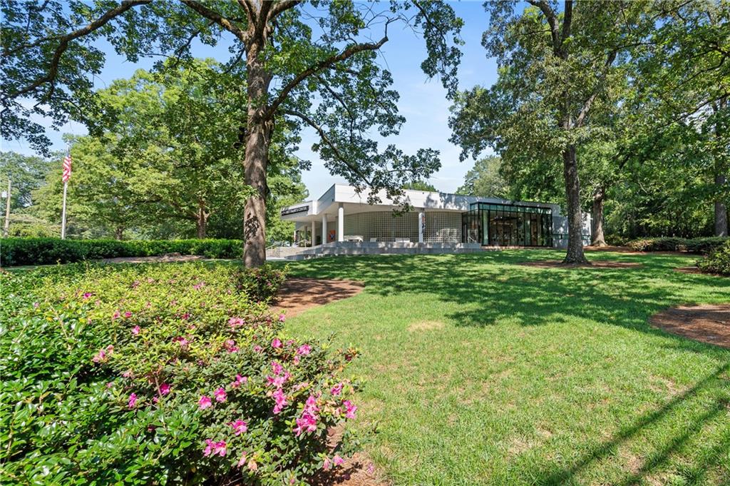 320 Anglin Walk Alpharetta, GA 30009 - Photo 53 of 67 a view of a house with a small yard and a large tree