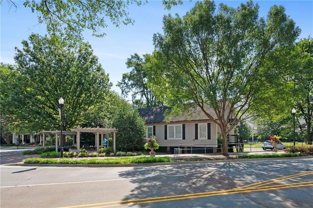 320 Anglin Walk Alpharetta, GA 30009 - Photo 59 of 67 a front view of a house with a yard
