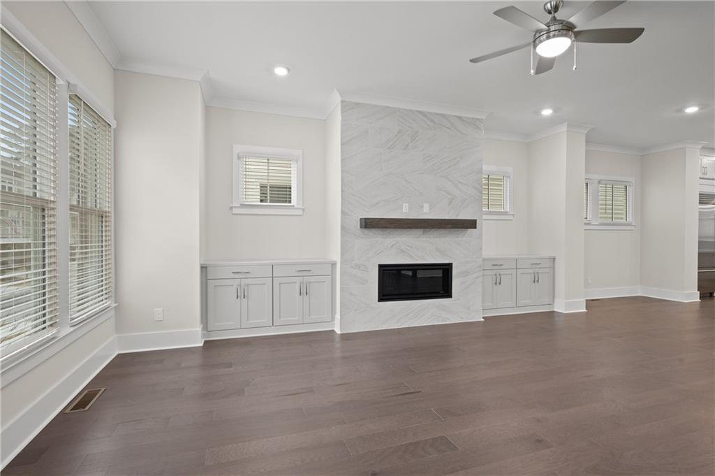 320 Anglin Walk Alpharetta, GA 30009 - Photo 7 of 67 a view of an empty room with a fireplace and a window