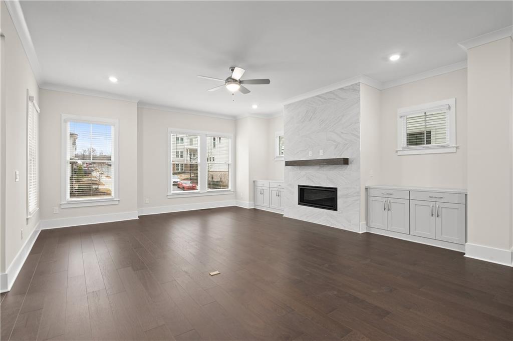 320 Anglin Walk Alpharetta, GA 30009 - Photo 9 of 67 a view of an empty room with window and wooden floor