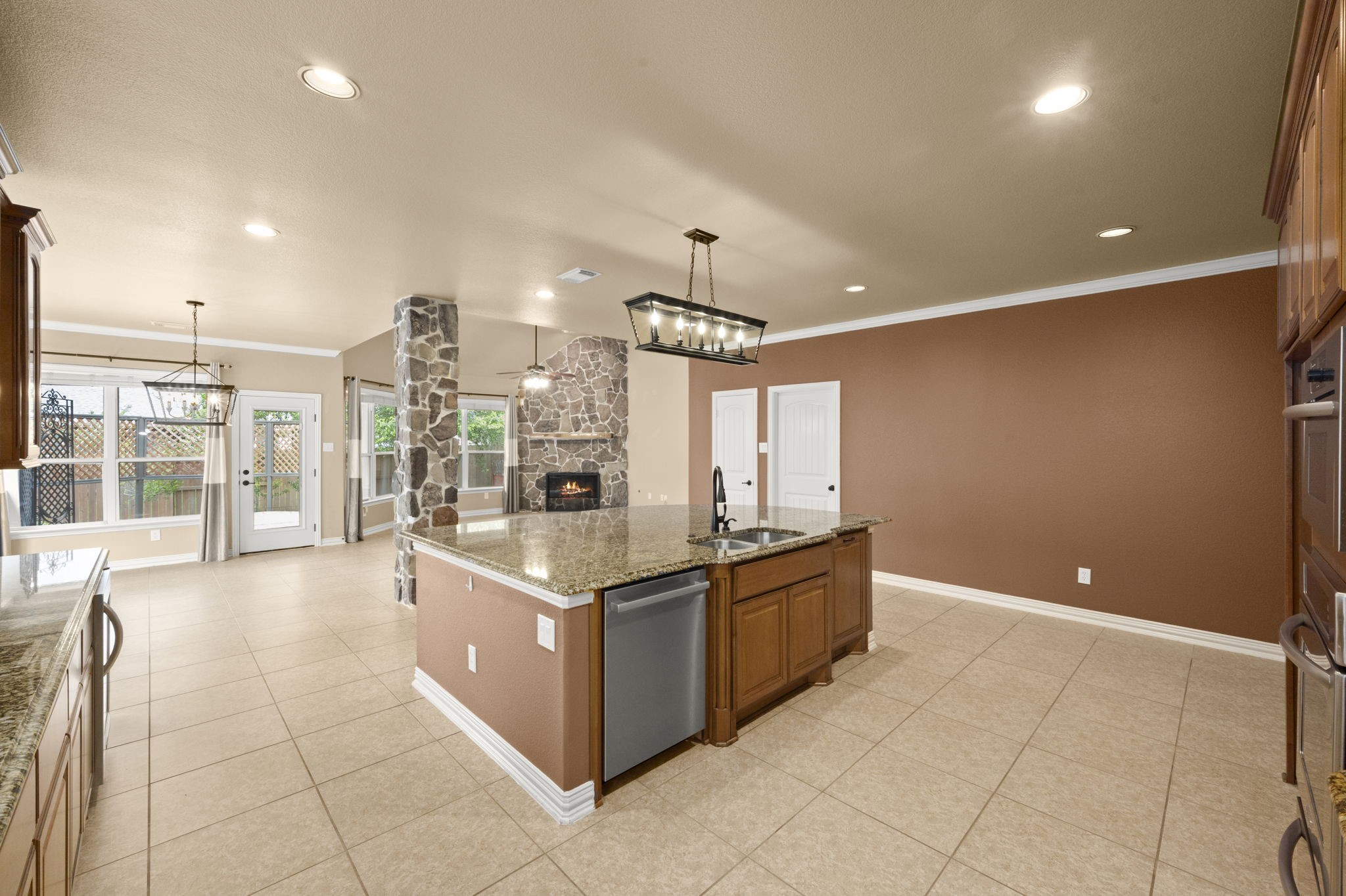 110 David Forest Lane Conroe, TX 77384 - Photo 16 of 35 a large kitchen with stainless steel appliances a large counter top a stove and a shower