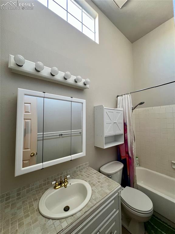 3150 Van Teylingen Drive, Unit E Colorado Springs, CO 80917 - Photo 19 of 24 a bathroom with a sink toilet and shower