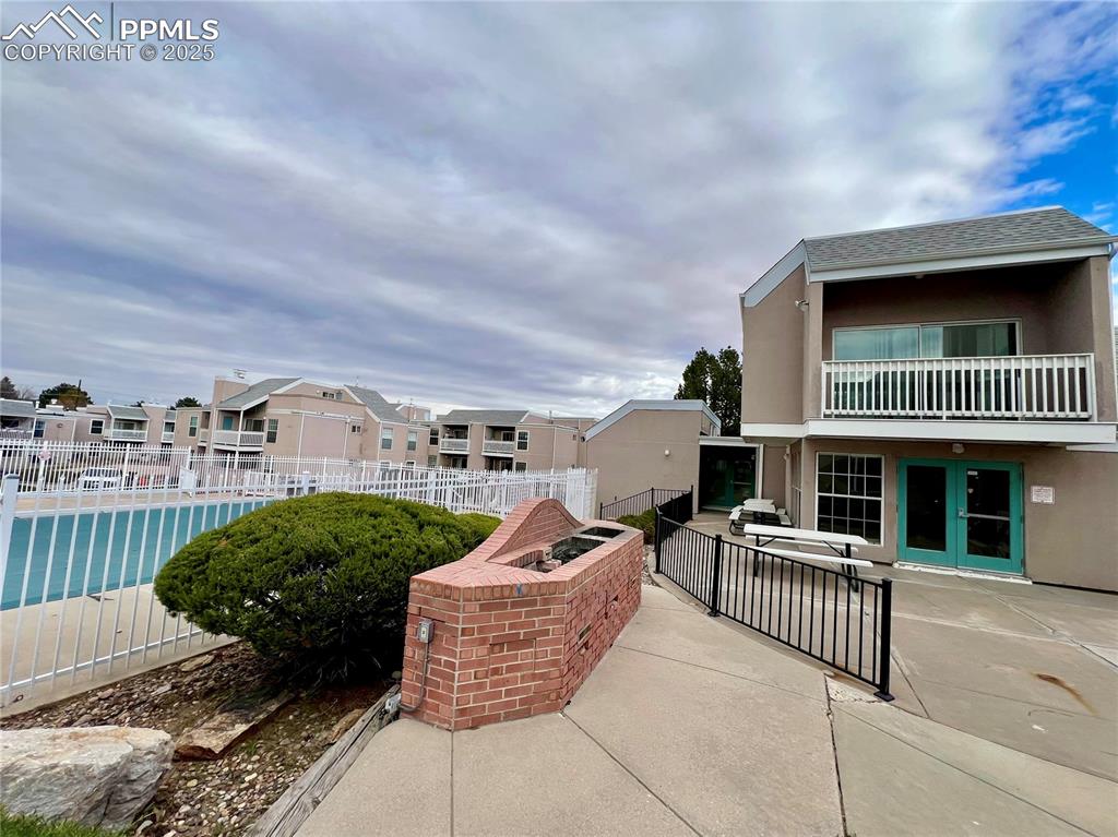 3150 Van Teylingen Drive, Unit E Colorado Springs, CO 80917 - Photo 21 of 24 a front view of a house with garden