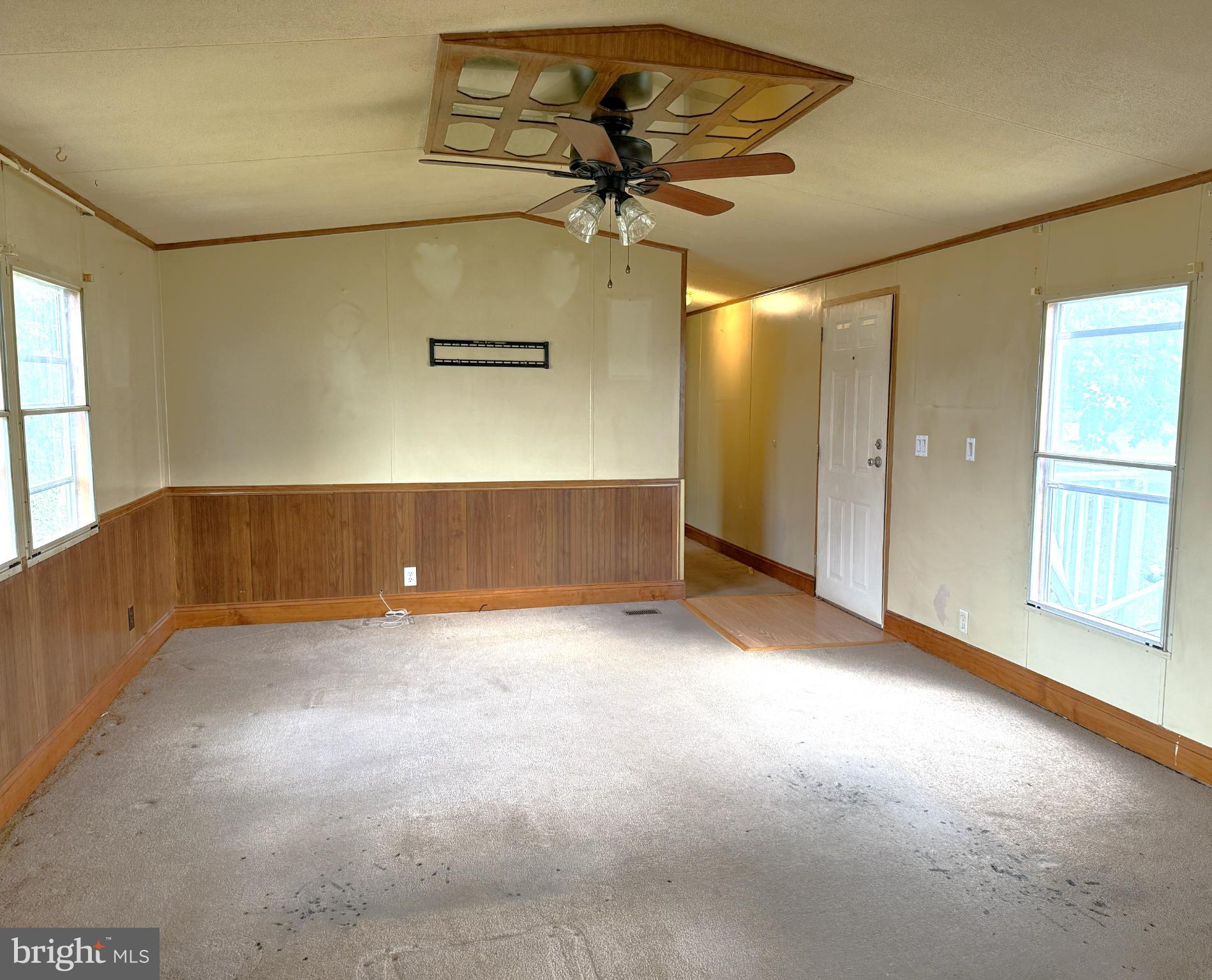 65 Big Spring Terrace Newville, PA 17241 - Photo 3 of 10 an empty room with a ceiling fan and window