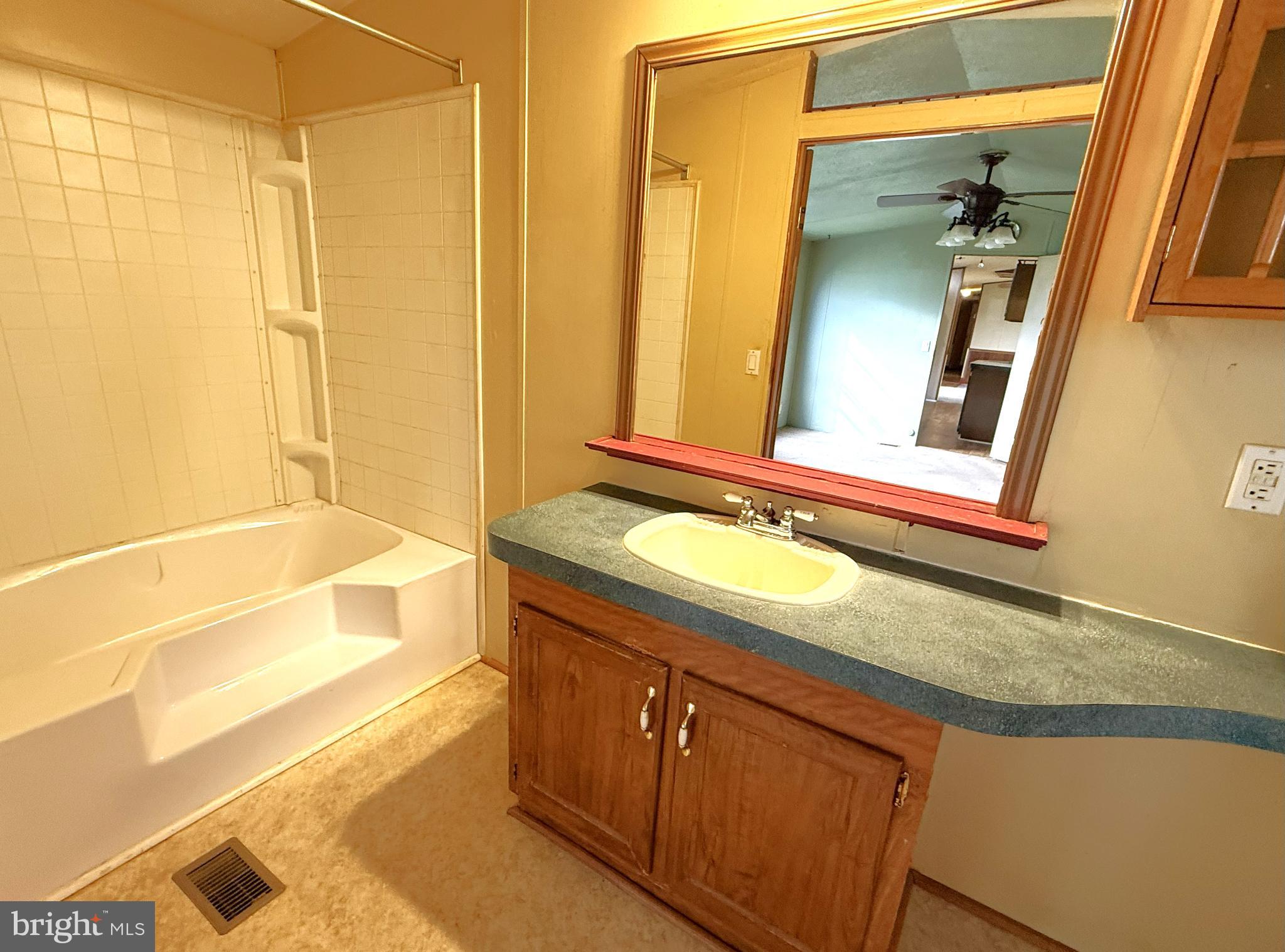 65 Big Spring Terrace Newville, PA 17241 - Photo 6 of 10 a bathroom with a granite countertop sink and a mirror