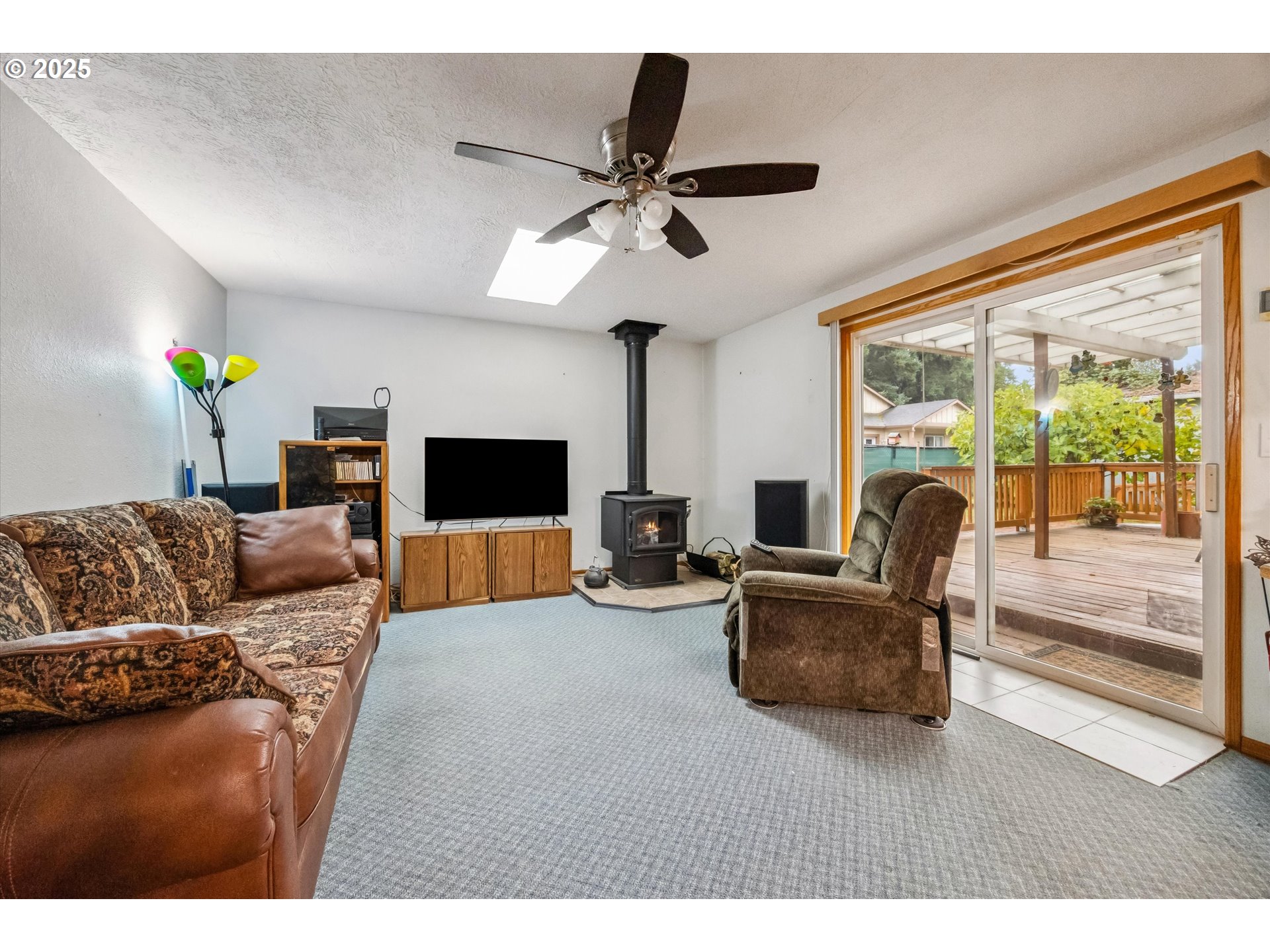825 Northeast 194th Avenue Portland, OR 97230 - Photo 14 of 27 a living room with furniture and a flat screen tv