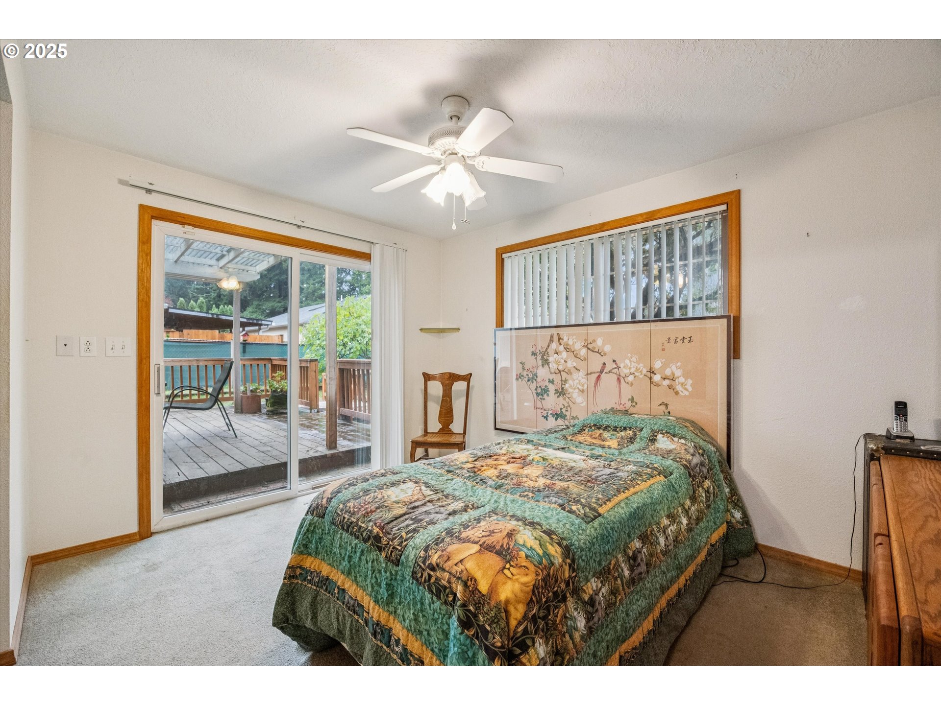 825 Northeast 194th Avenue Portland, OR 97230 - Photo 17 of 27 a bedroom with a large bed and a window