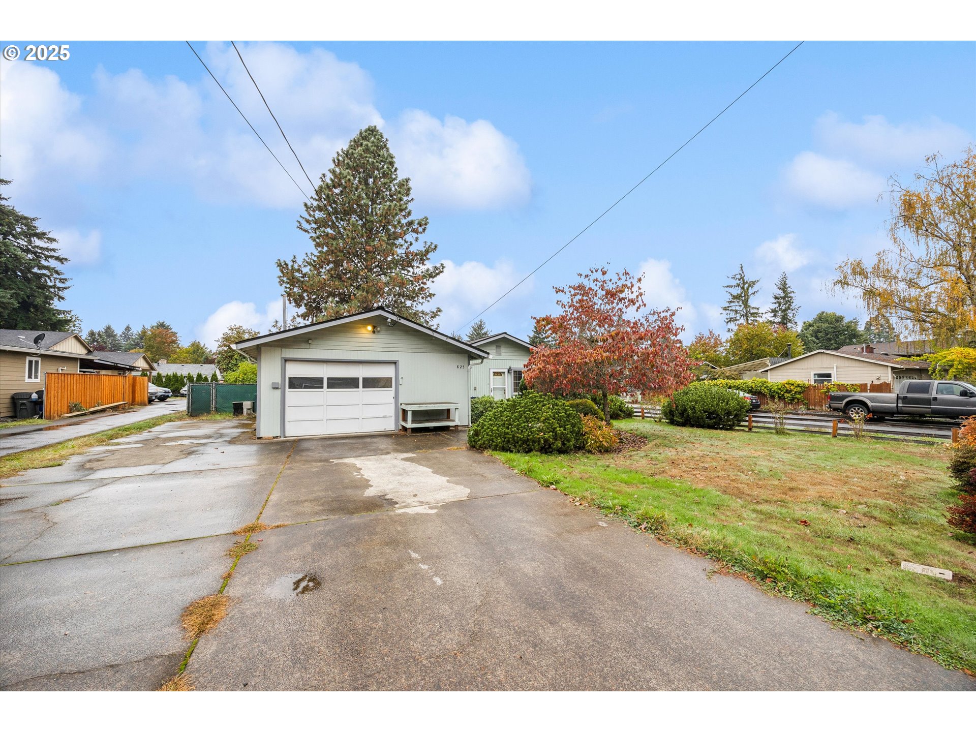 825 Northeast 194th Avenue Portland, OR 97230 - Photo 3 of 27 a view of a house with a yard and garage