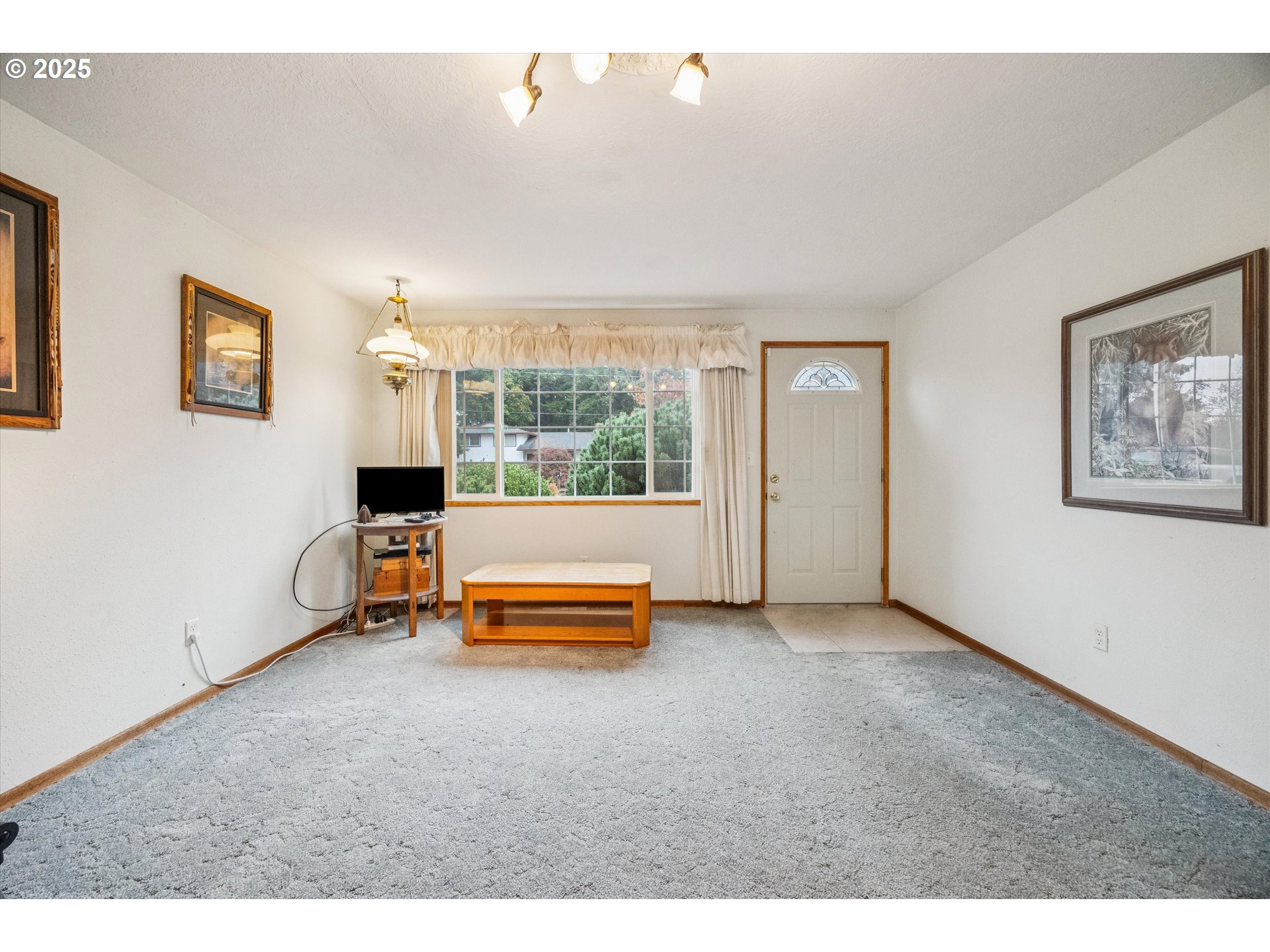 825 Northeast 194th Avenue Portland, OR 97230 - Photo 6 of 27 a view of a room with furniture wooden floor and window