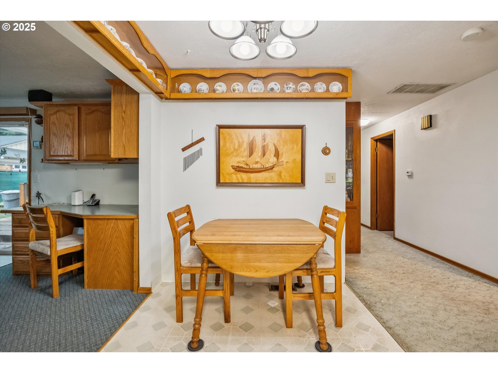 825 Northeast 194th Avenue Portland, OR 97230 - Photo 7 of 27 a view of a dining room with furniture and a chandelier