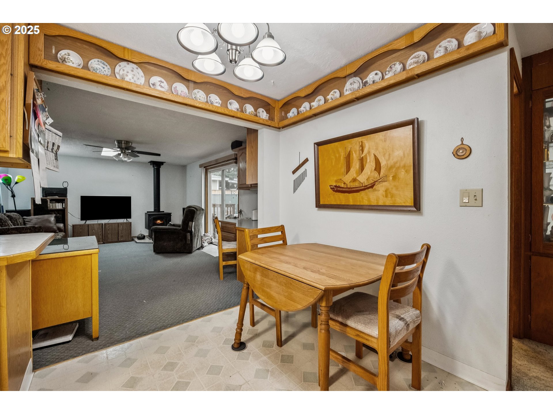 825 Northeast 194th Avenue Portland, OR 97230 - Photo 8 of 27 a dining room with furniture and a flat screen tv