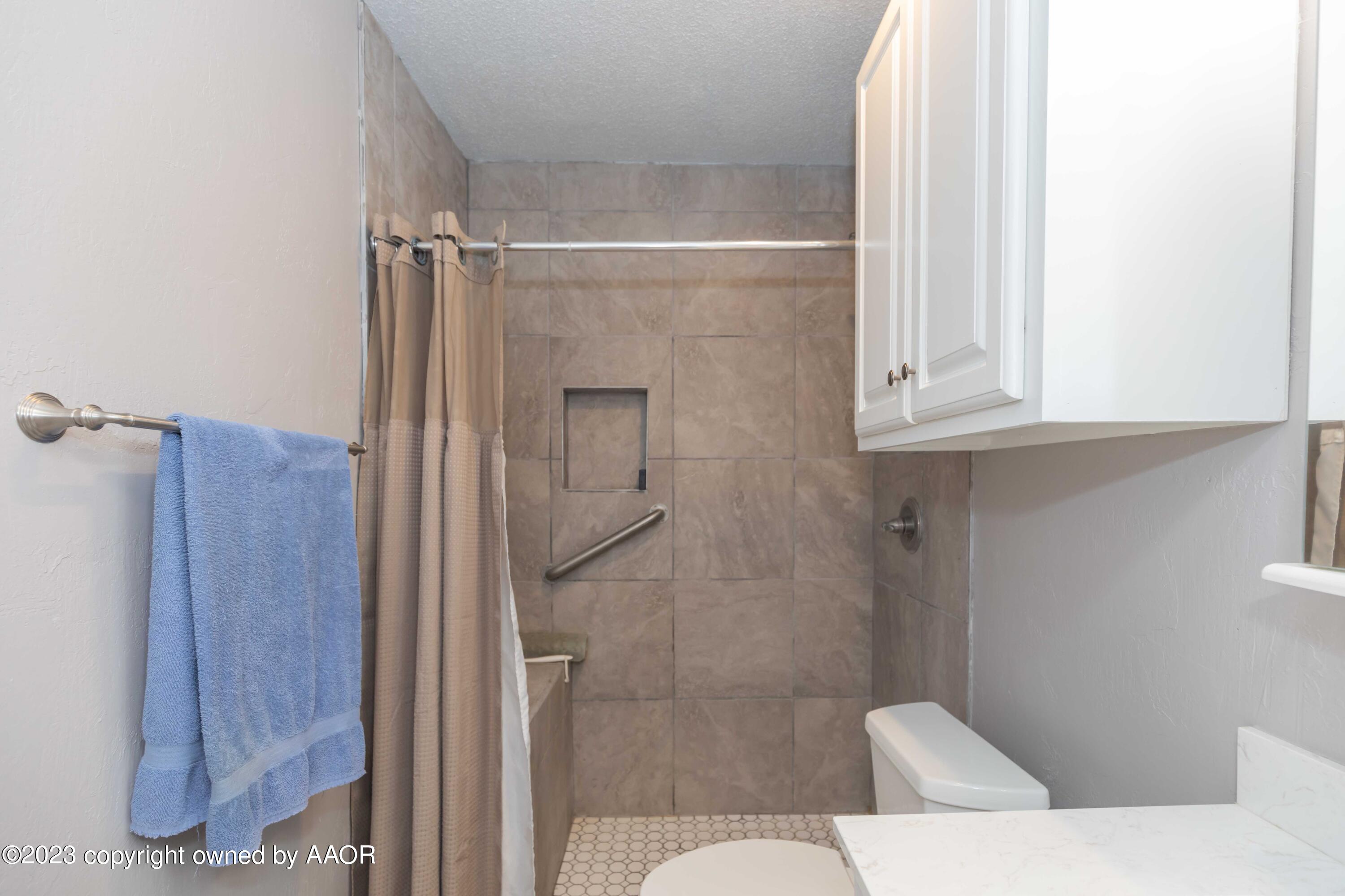 2920 South Nelson Street Amarillo, TX 79103 - Photo 28 of 47 a bathroom with a shower and toilet