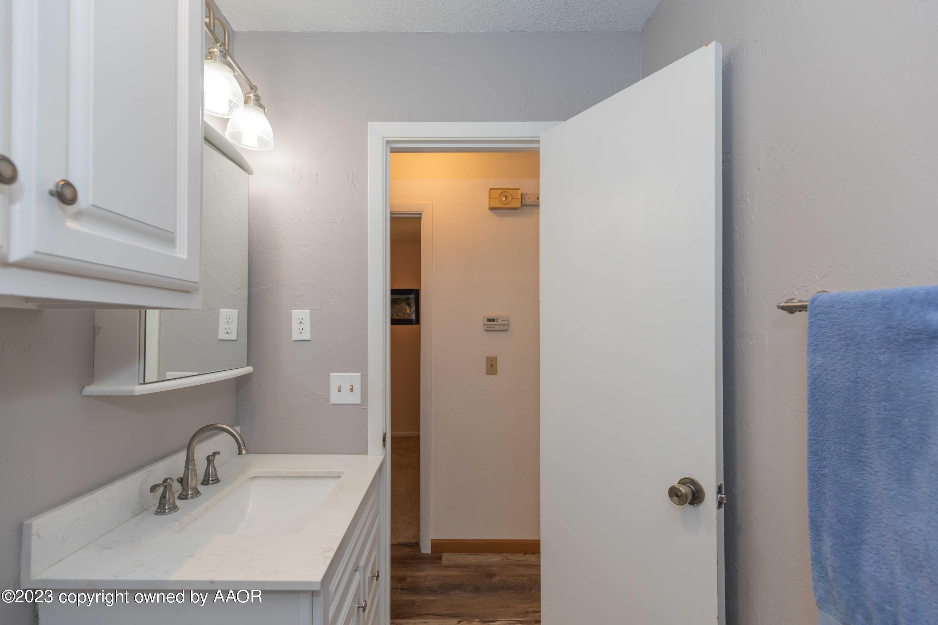 2920 South Nelson Street Amarillo, TX 79103 - Photo 29 of 47 a bathroom with a sink vanity and a mirror