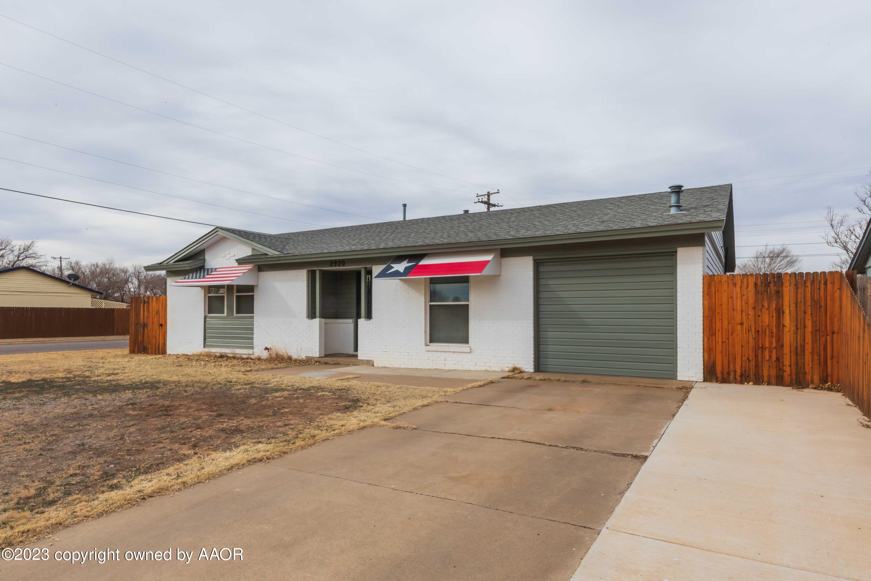 2920 South Nelson Street Amarillo, TX 79103 - Photo 4 of 47 a front view of a house with a garage