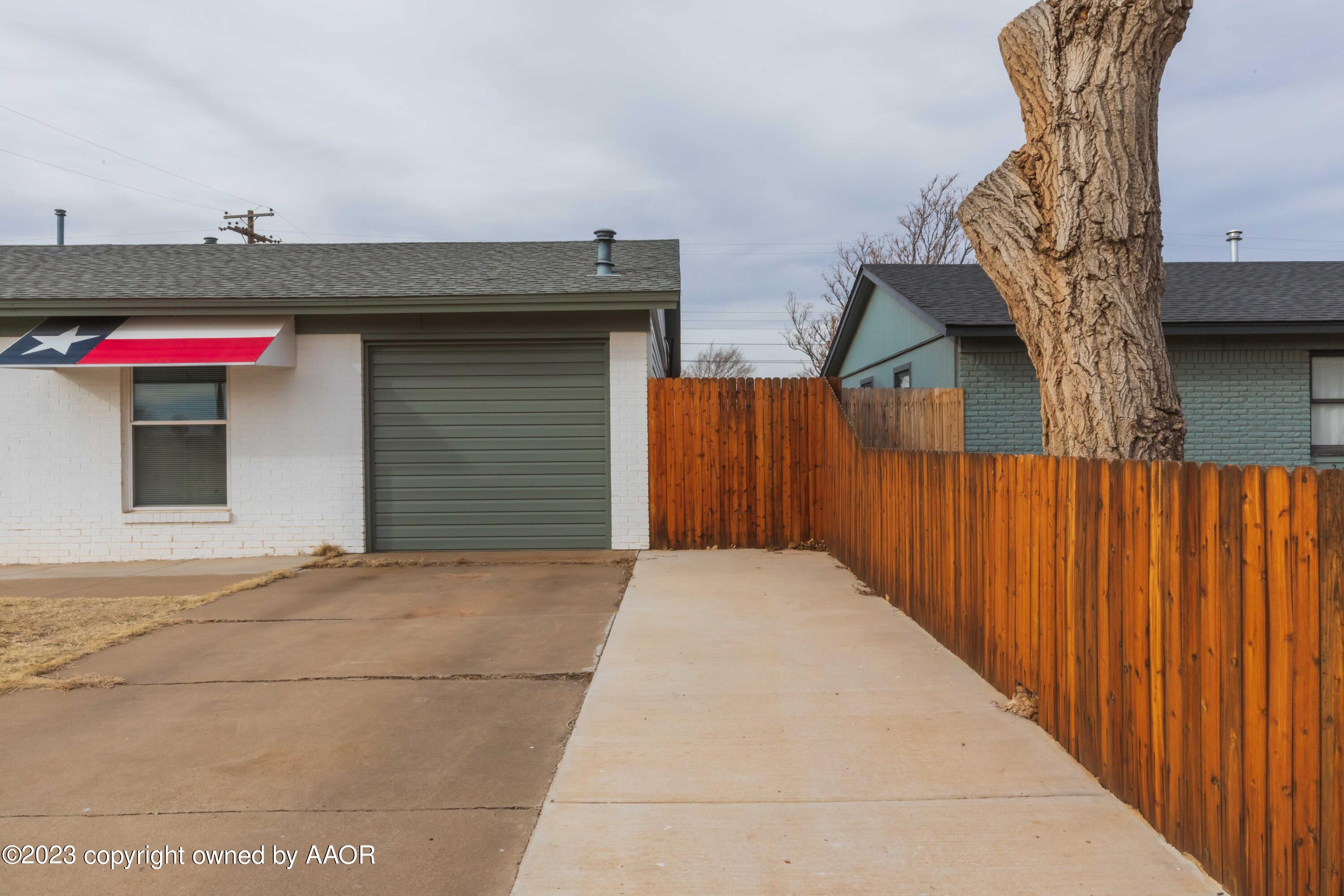 2920 South Nelson Street Amarillo, TX 79103 - Photo 5 of 47 a front view of a house with a garage