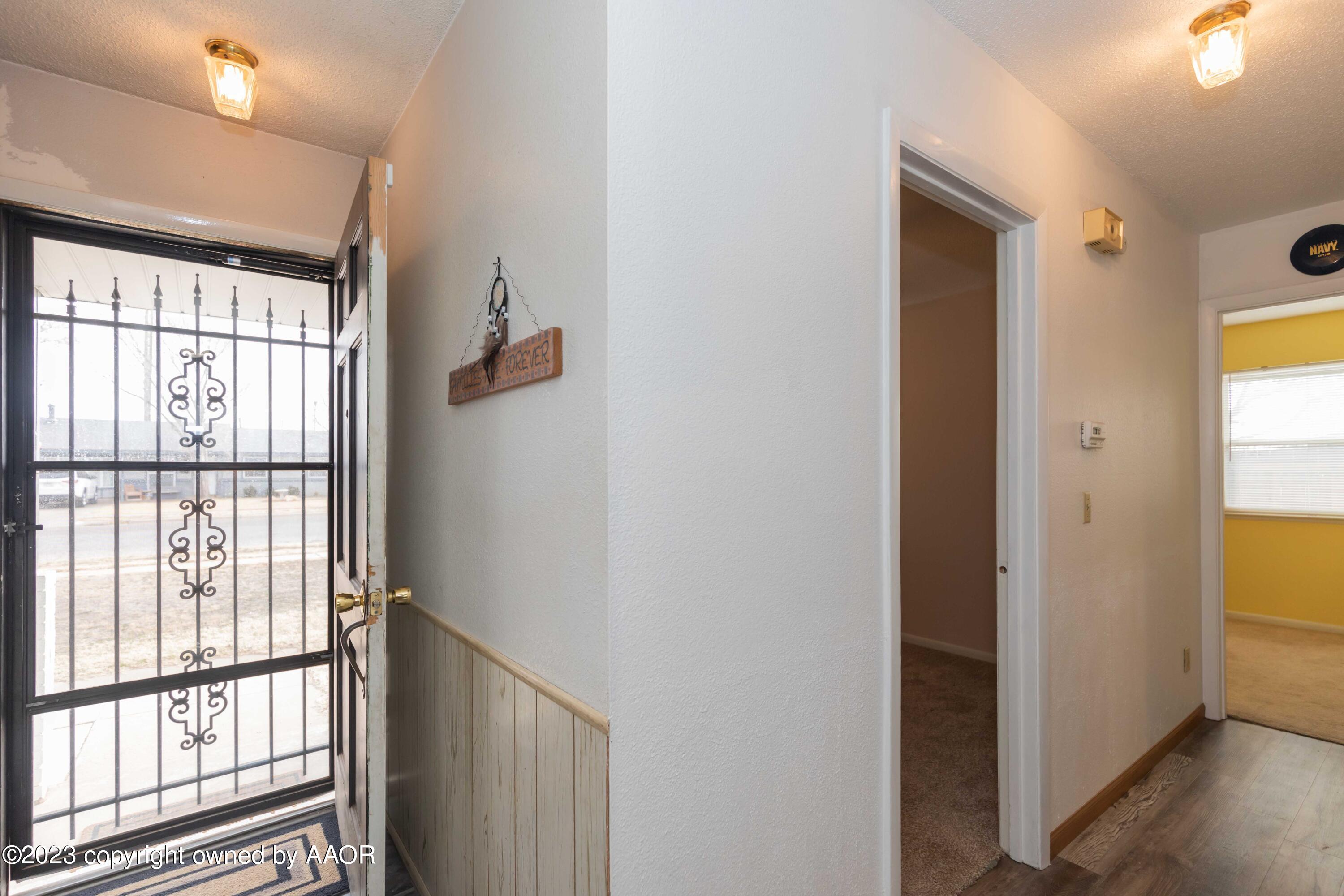 2920 South Nelson Street Amarillo, TX 79103 - Photo 6 of 47 a view of hallway with wooden floor and stairs