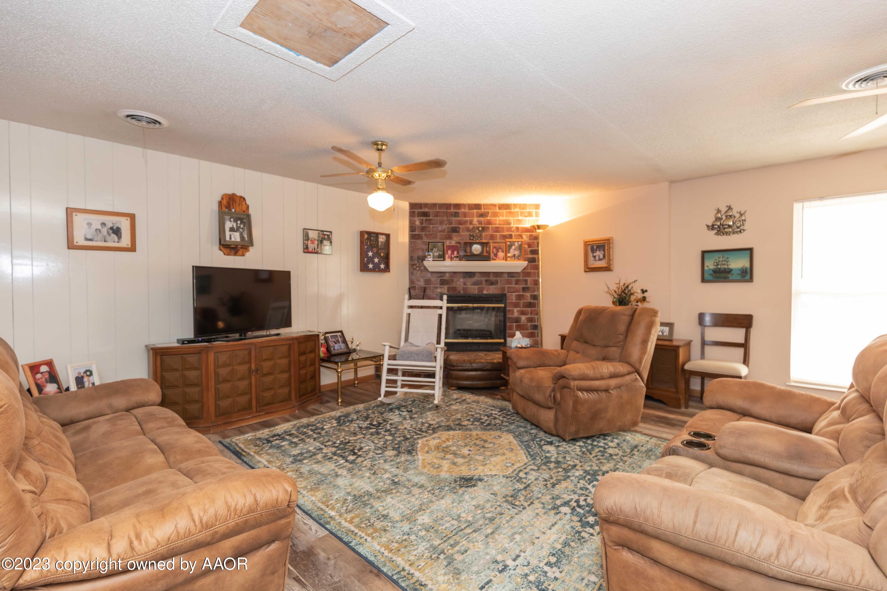 2920 South Nelson Street Amarillo, TX 79103 - Photo 7 of 47 a living room with furniture and a flat screen tv