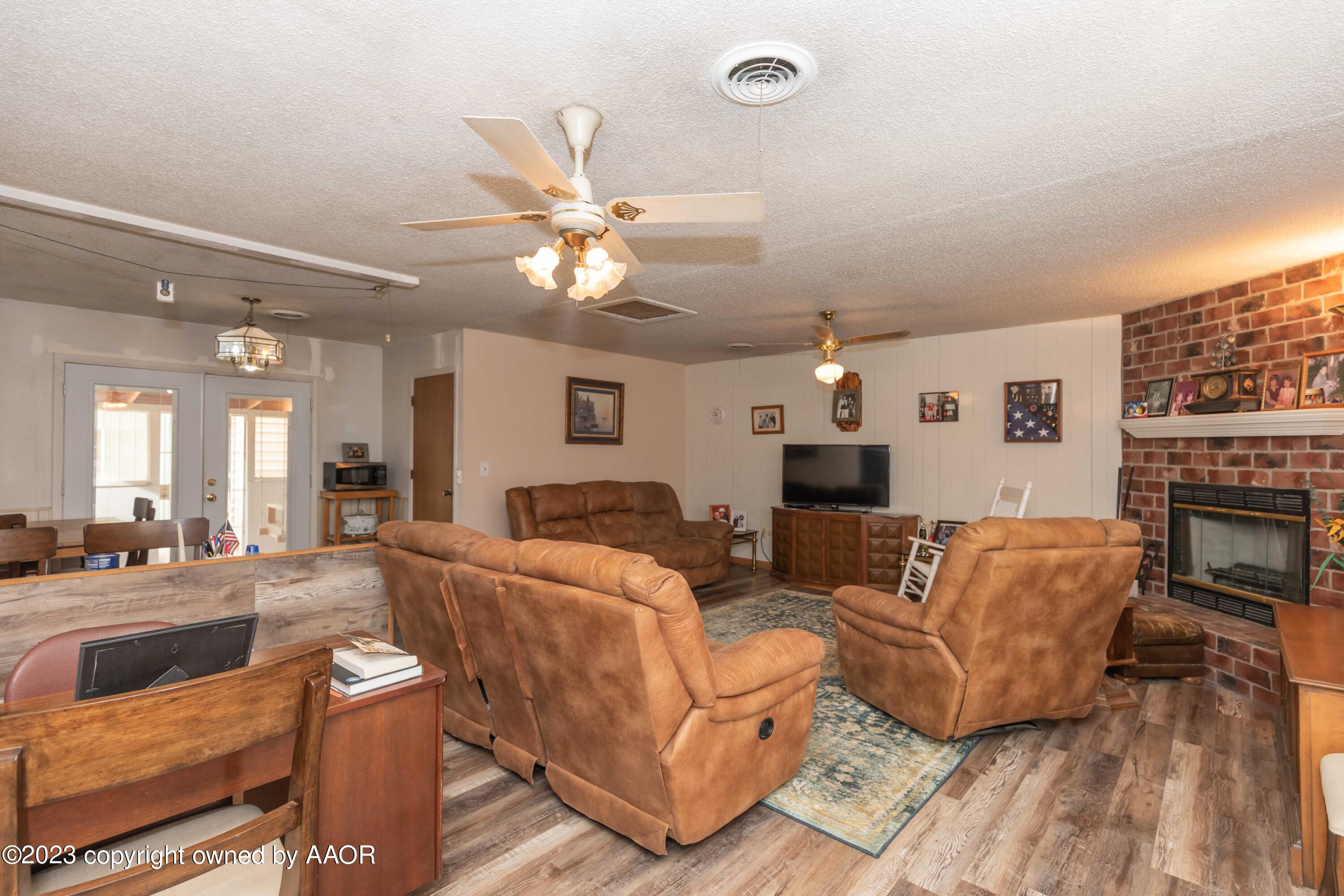 2920 South Nelson Street Amarillo, TX 79103 - Photo 9 of 47 a living room with furniture and a fireplace