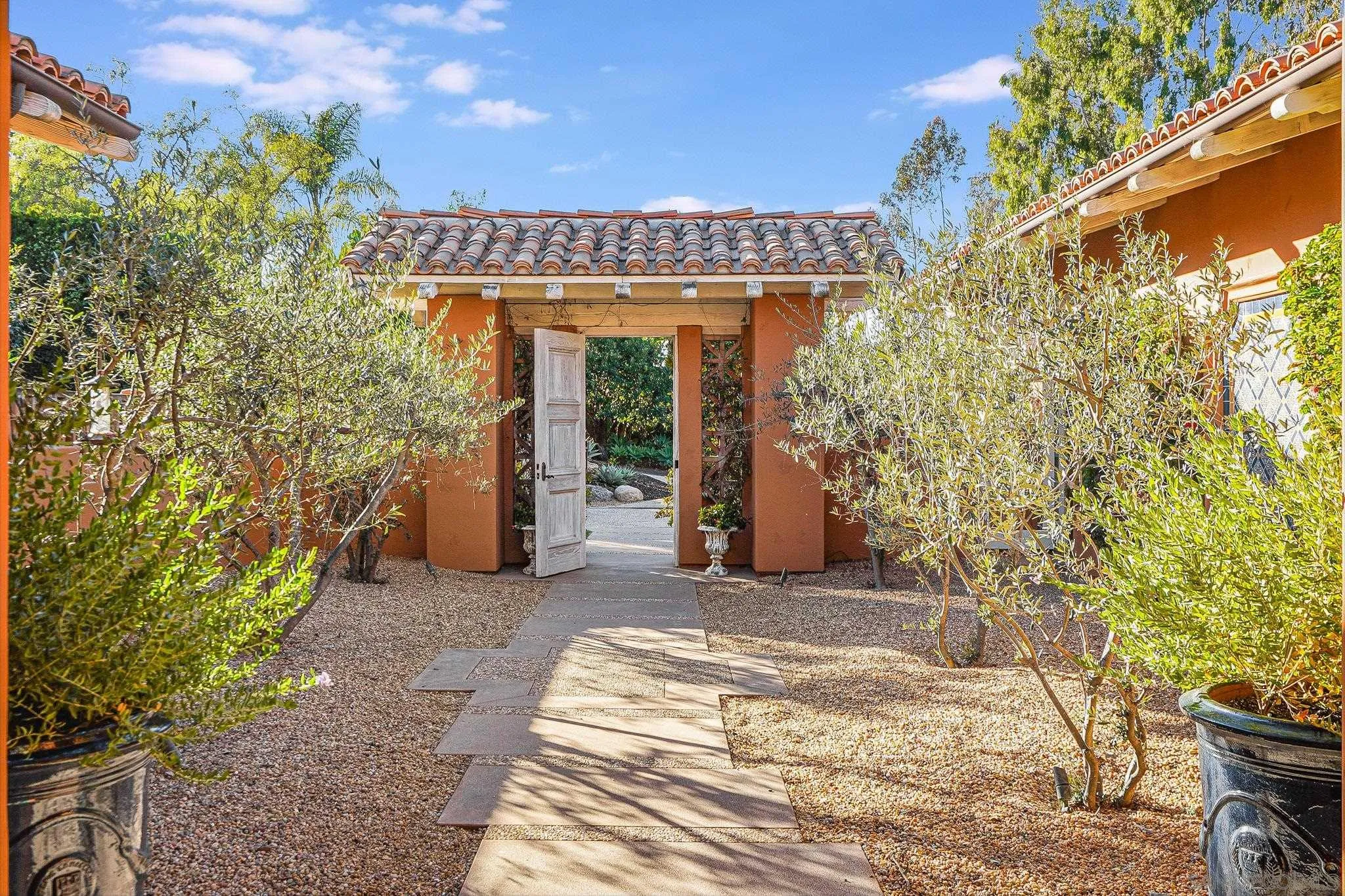 6182 Paseo Valencia Rancho Santa Fe, CA 92067 - Photo 5 of 26 a view of a entryway door of the house