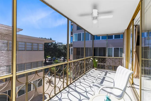 a front view of a building with a garden