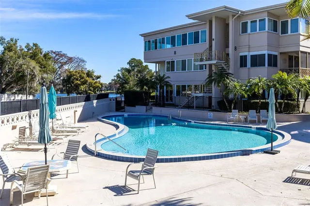 a view of a swimming pool with a yard