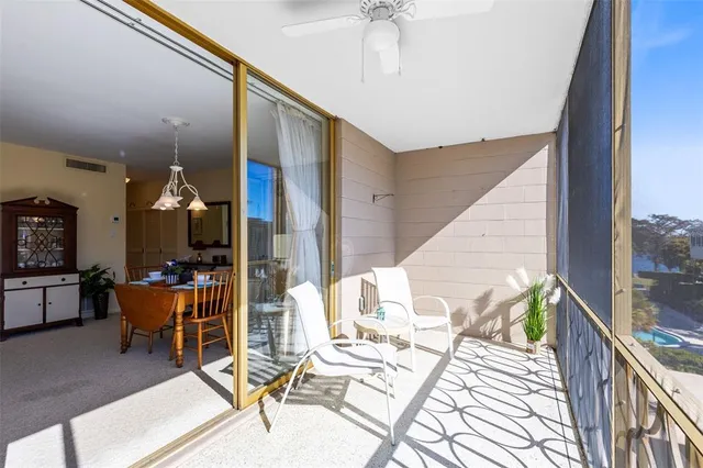 a living room with chairs and a table