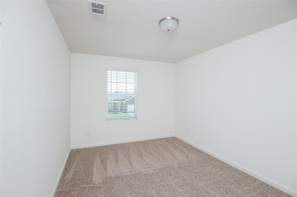 505 Canoe Way Crowley, TX 76036 - Photo 12 of 17 an empty room with a window