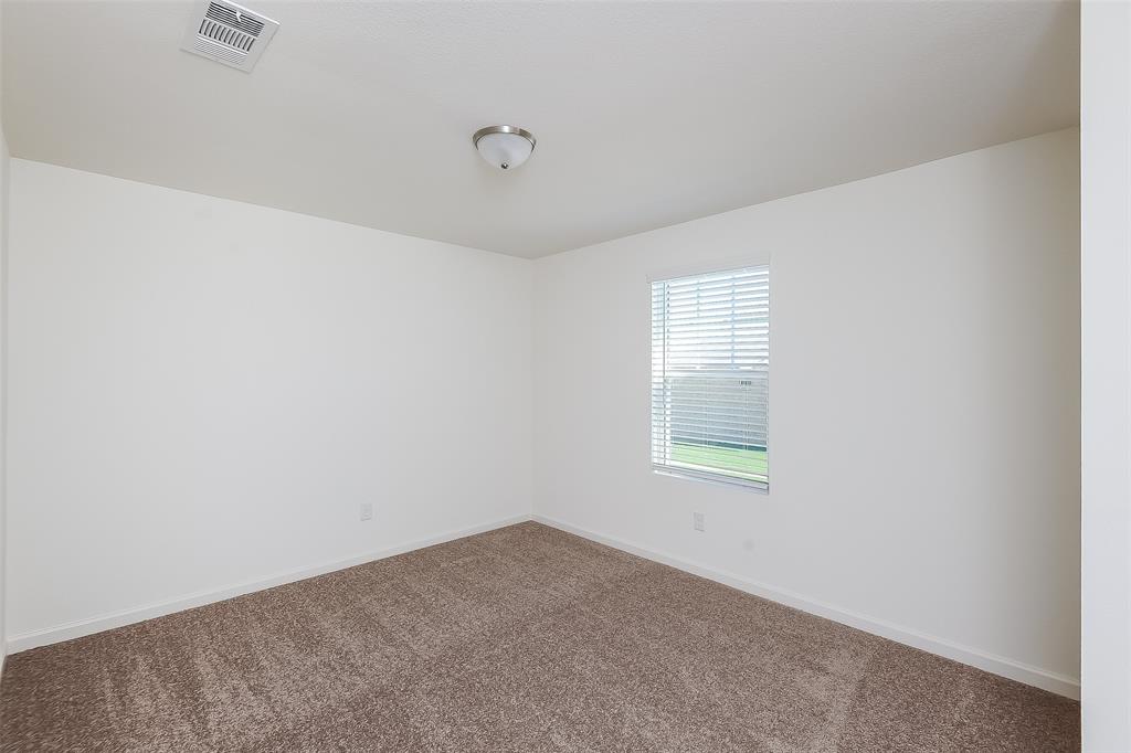 505 Canoe Way Crowley, TX 76036 - Photo 13 of 17 an empty room with a window