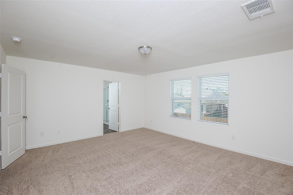 505 Canoe Way Crowley, TX 76036 - Photo 8 of 17 a view of an empty room with a window