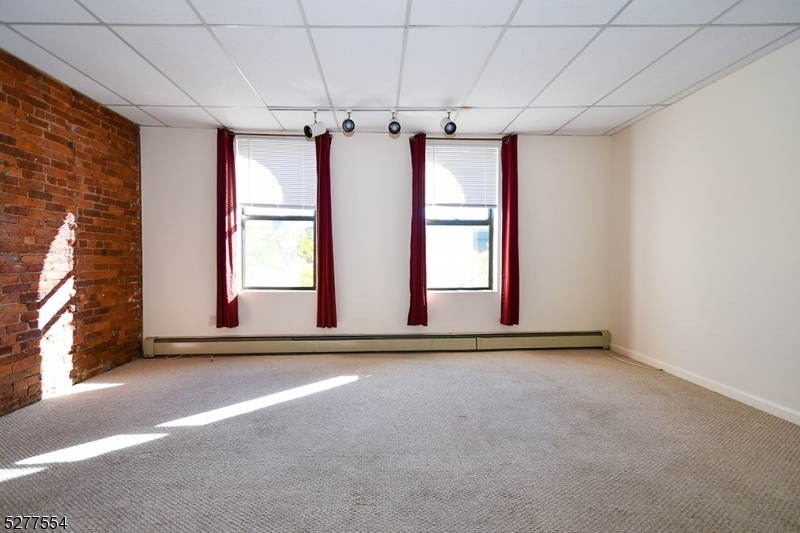 431 Springfield Avenue, Unit 6 Summit, NJ 07901 - Photo 3 of 9 a view of an empty room with a window