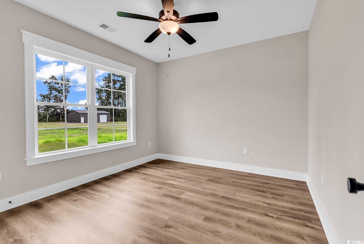 713 Horry Road Aynor, SC 29511 - Photo 28 of 40 Spare room with light wood-style flooring and ceiling fan
