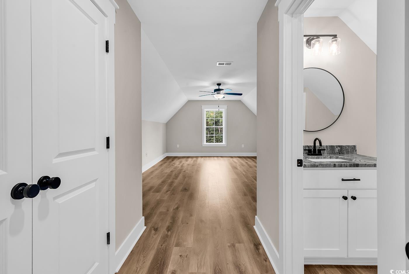 713 Horry Road Aynor, SC 29511 - Photo 31 of 40 Additional living space with lofted ceiling, light wood-style floors, and ceiling fan