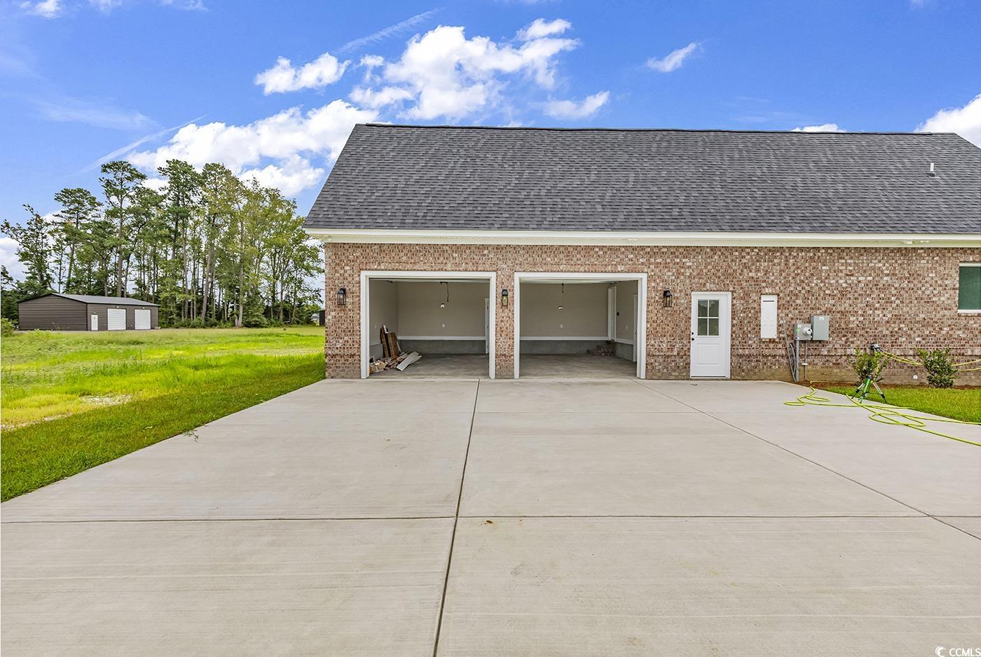 713 Horry Road Aynor, SC 29511 - Photo 34 of 40 Garage with driveway