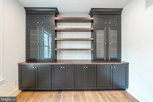 a kitchen with a sink and cabinets